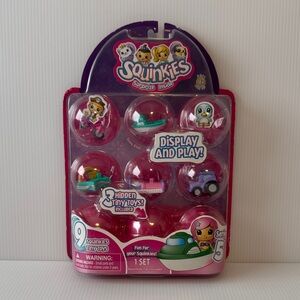 NIB. Squinkies Surprise Inside Toy Set - Pink and Purple